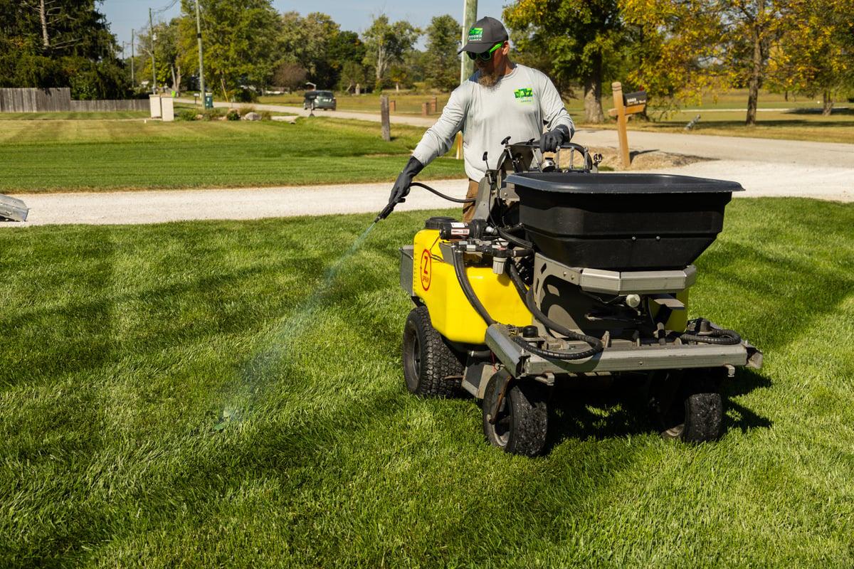 Lawn care company applying pre emergent weed control in Abilene TX